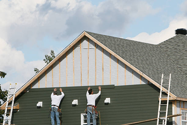 Professional Siding Contractor technician working in Whitsett, NC